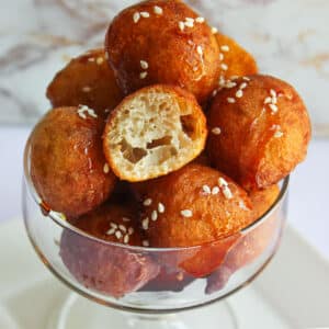 Crunghy luqaimat in a glass bowl.