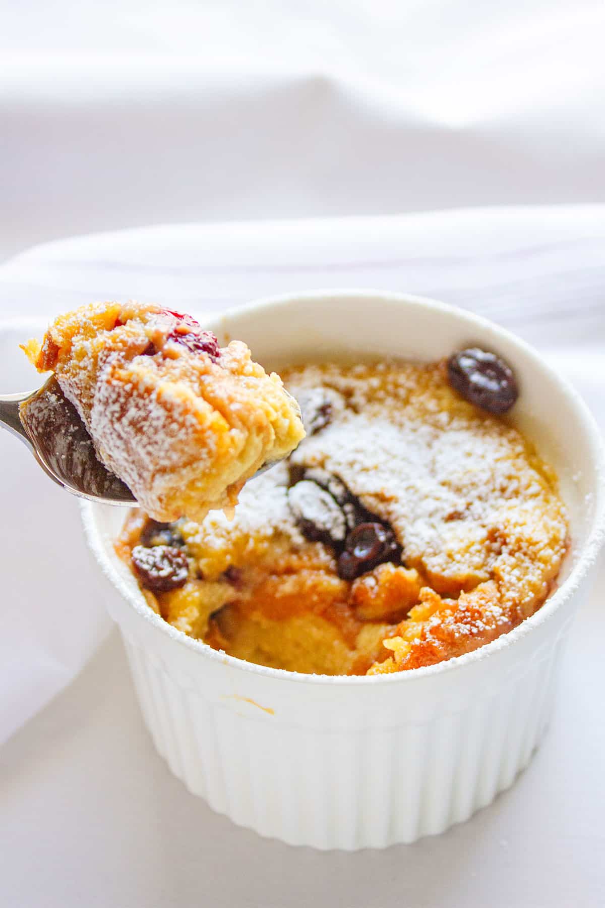blackberry bread pudding with a spoon.