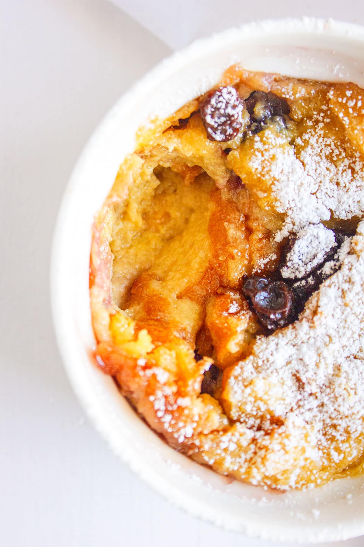 Blackberry bread pudding with fresh berries showing.
