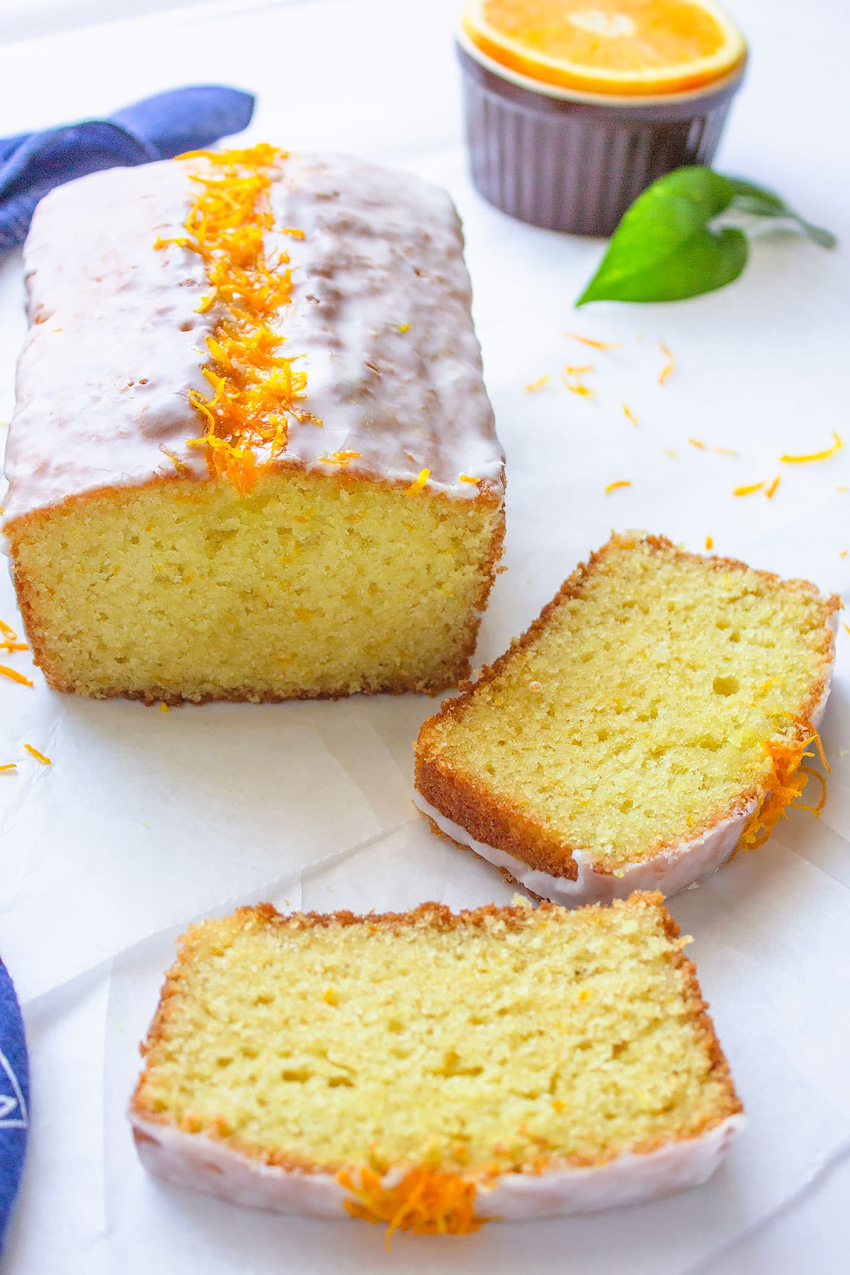 Orange sour cream cake freshly baked and served with white glaze.