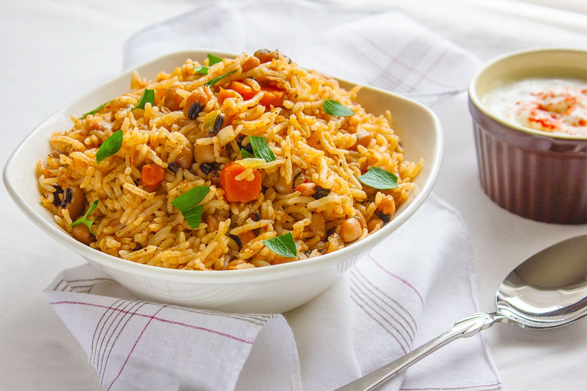 Black eyed peas with rice, served with yogurt on the side.
