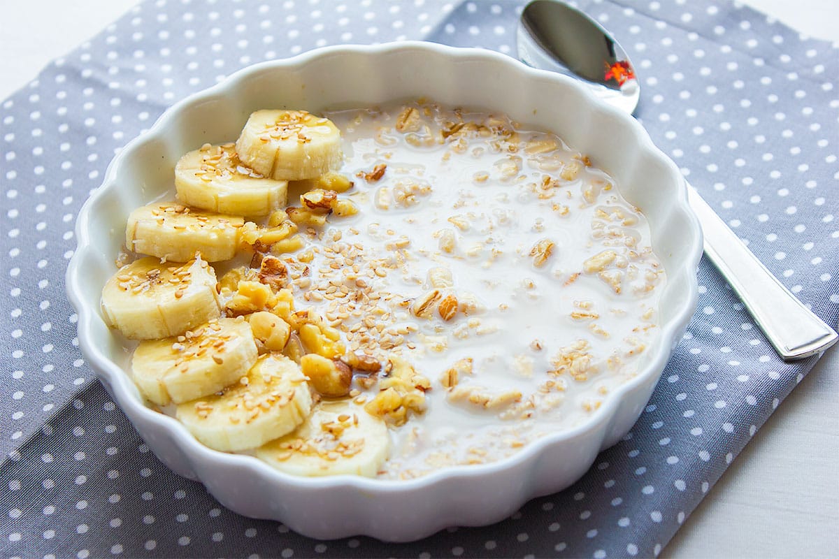 Banana overnight oats served in a white bowl.