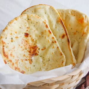 Butter Naan in a basket, freshly prepared.