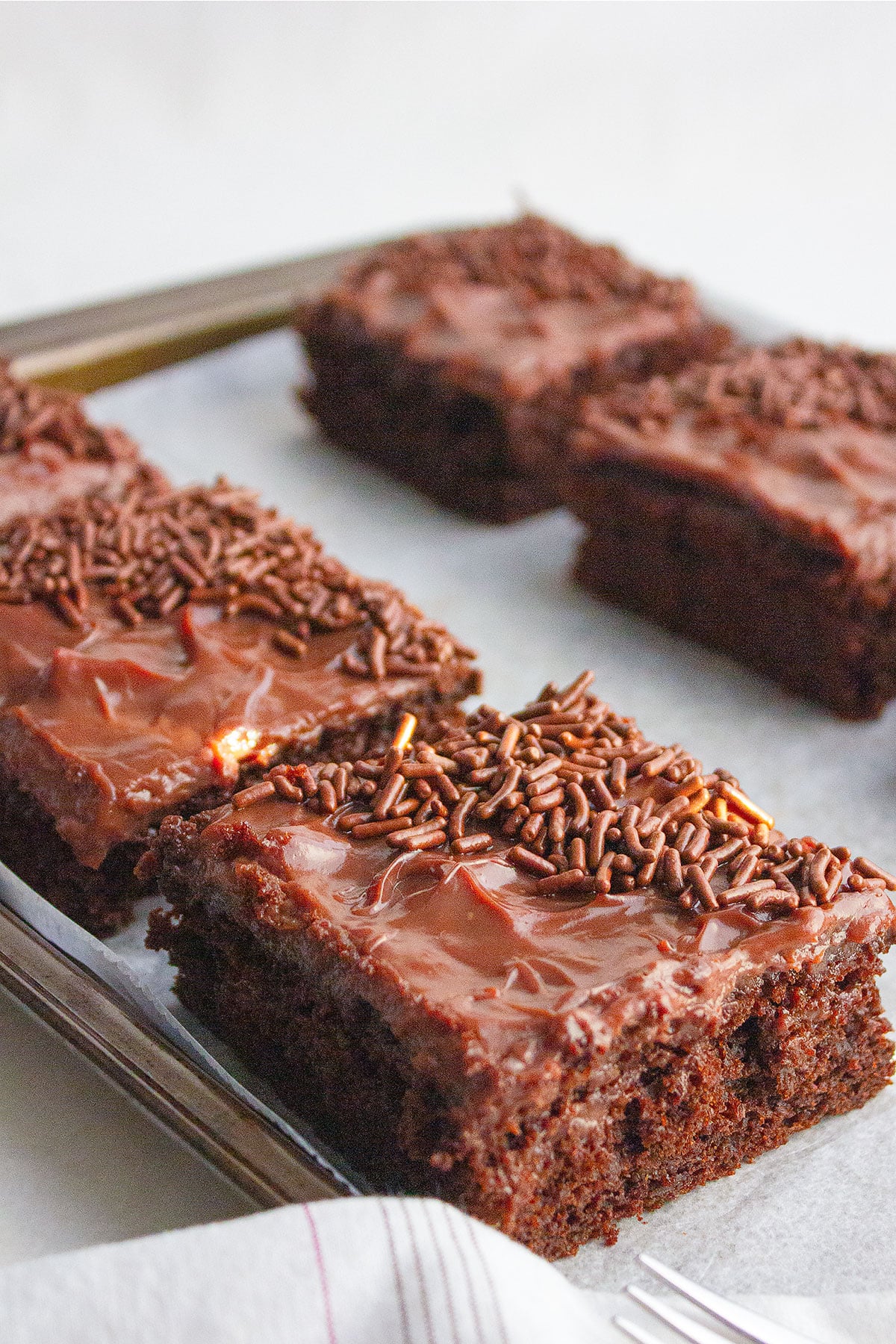 Chocolate cake bars served on the baking sheet. 2026