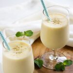 Mango Lassi. Mango chunks mixed with yogurt and milk creates an amazingly creamy, delicious, and healthy mango smoothie. Perfect and refreshing! www.munatycooking.com | @munatycooking