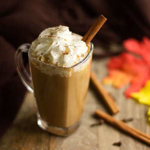 Pumpkin spice latte served in a glass .