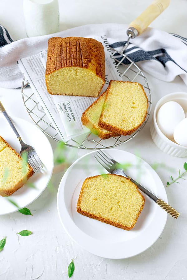 hot milk cake slice served on white plate.