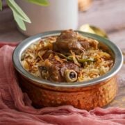 Freshly made yakhni pulao served in a bowl.