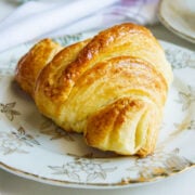 Quick Croissant on a white plate. Feature 2023.