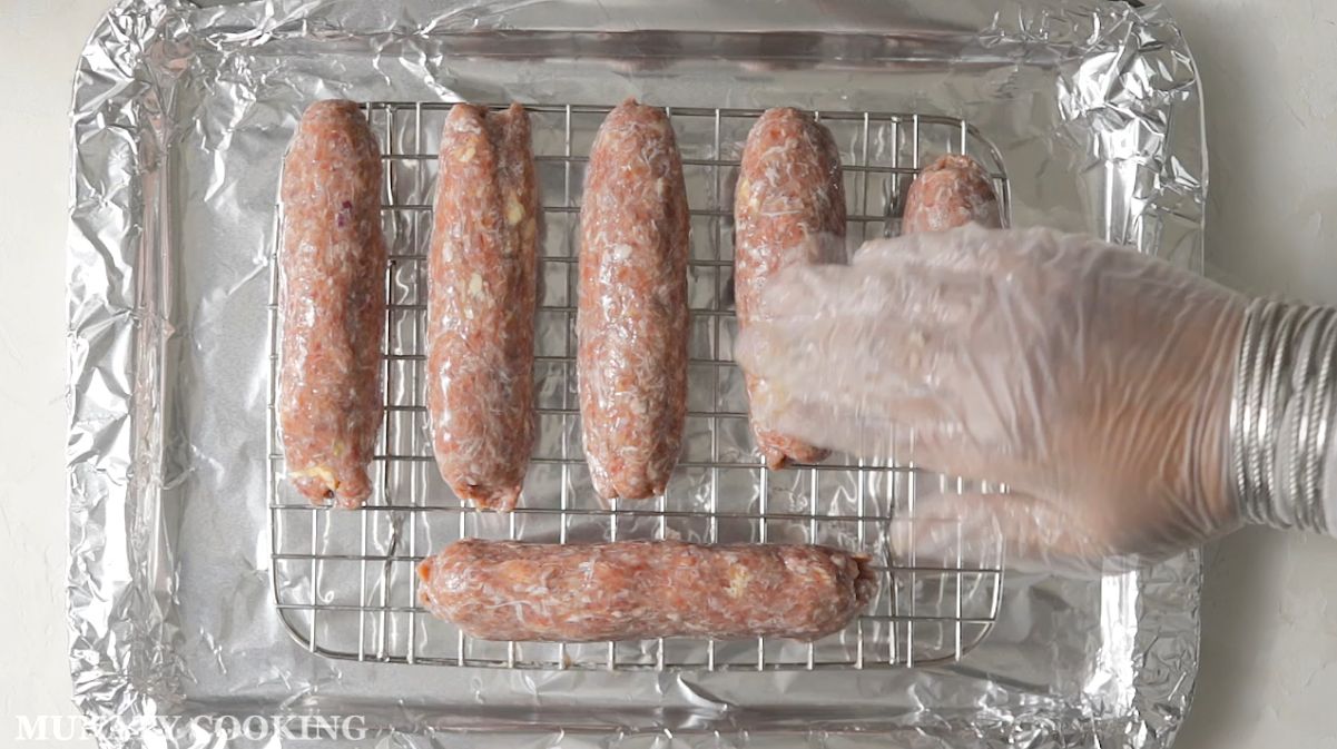 Applying onion water to shaped koftas.