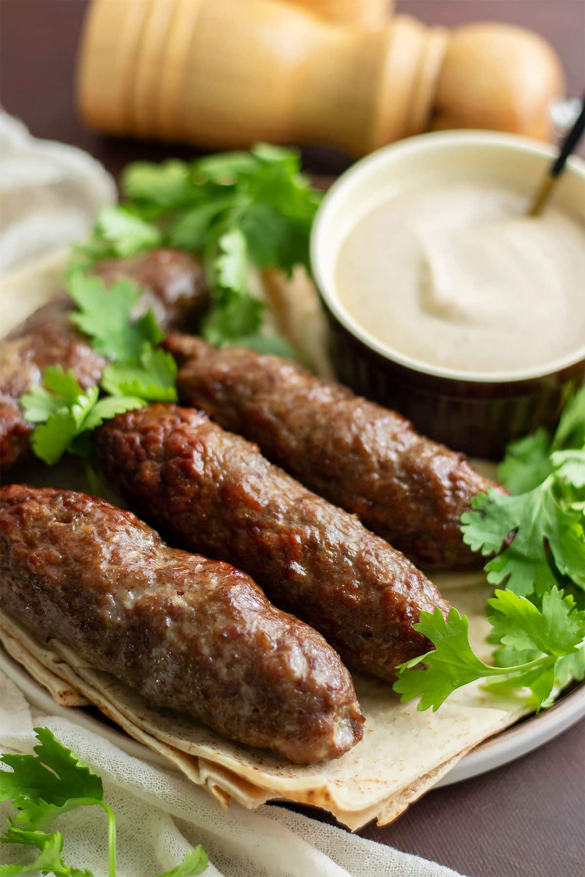 Freshly cooked kofta served with tahini sauce.