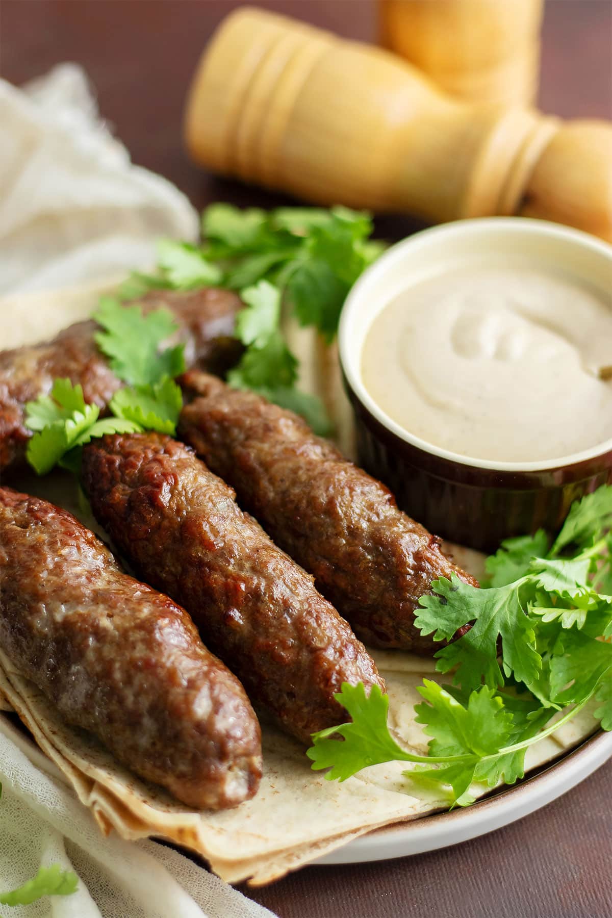 Kofta with tahini sauce on the side.