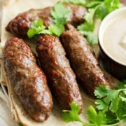 Close up image of kofta on pita bread.