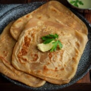 Paratha (Indian Flar Bread) served with butter.