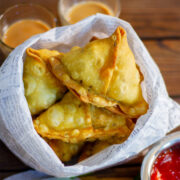 Punjabi Aloo samosa in a paper bag.