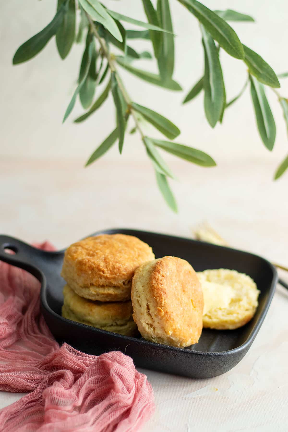 Fluffy biscuits served on a black plate.