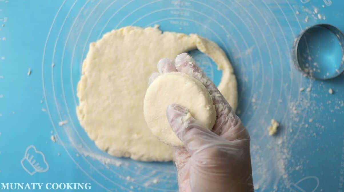Cutting the biscuits dough into circles.