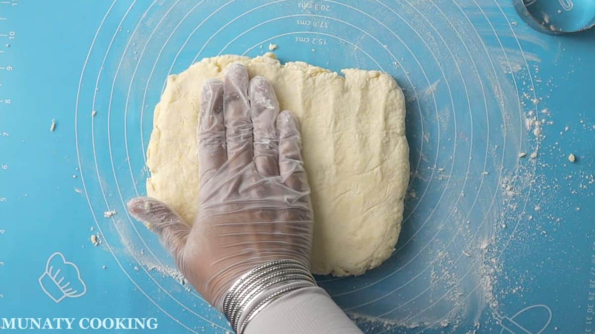 Southern biscuit dough on a flour dusted wrking space.