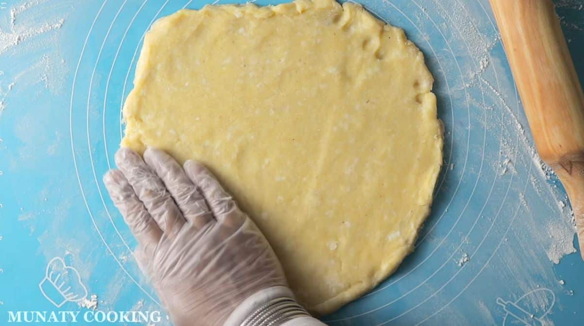 Rolled out cookie dough on working surface.