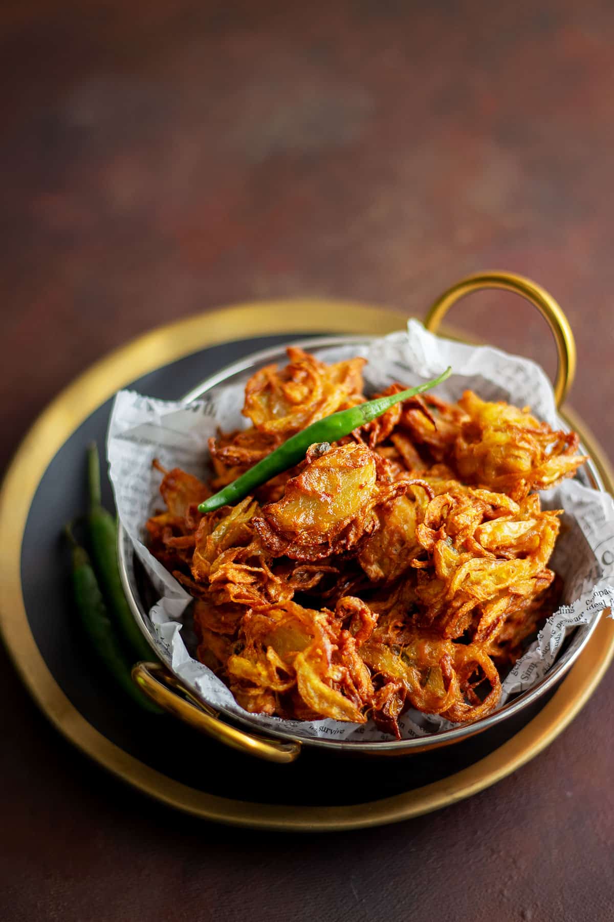 Freshly prepared crispy onion pakoras.