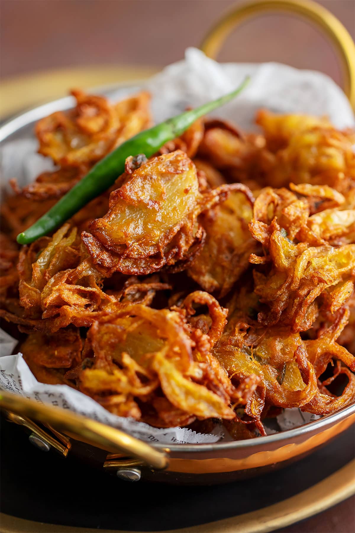 Indian snack onion pakora crispy with golden color.