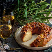 Pecan upside down cake served on a plate. Showing moist slices from the cake.
