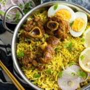 Quick Donne Biryani made with mutton served with boiled eggs.