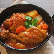 Arabic chicken stew served in a black bowl.