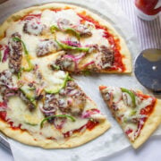 Burger Pizza, a pizza topped with strippes of beef burger, veggies, and cheese.