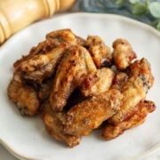 Garlic Parmesan Chicken Wings tossed in a delicious parmesan sauce.