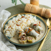Kousa bil laban served with Lebanese rice in a plate.
