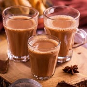 Three glasses filled with karak chai.