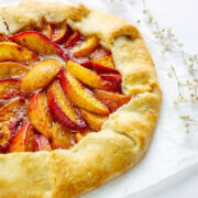 A beautiful rustic peach galette filled with ripe peaches.