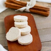 Cinnamon butter served in slices on a wooden board.