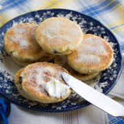 Welsh cakes served in a plate with table cream.