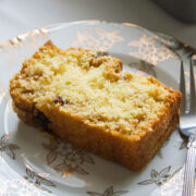 Close up image of coffee loaf cake slice on a plate.