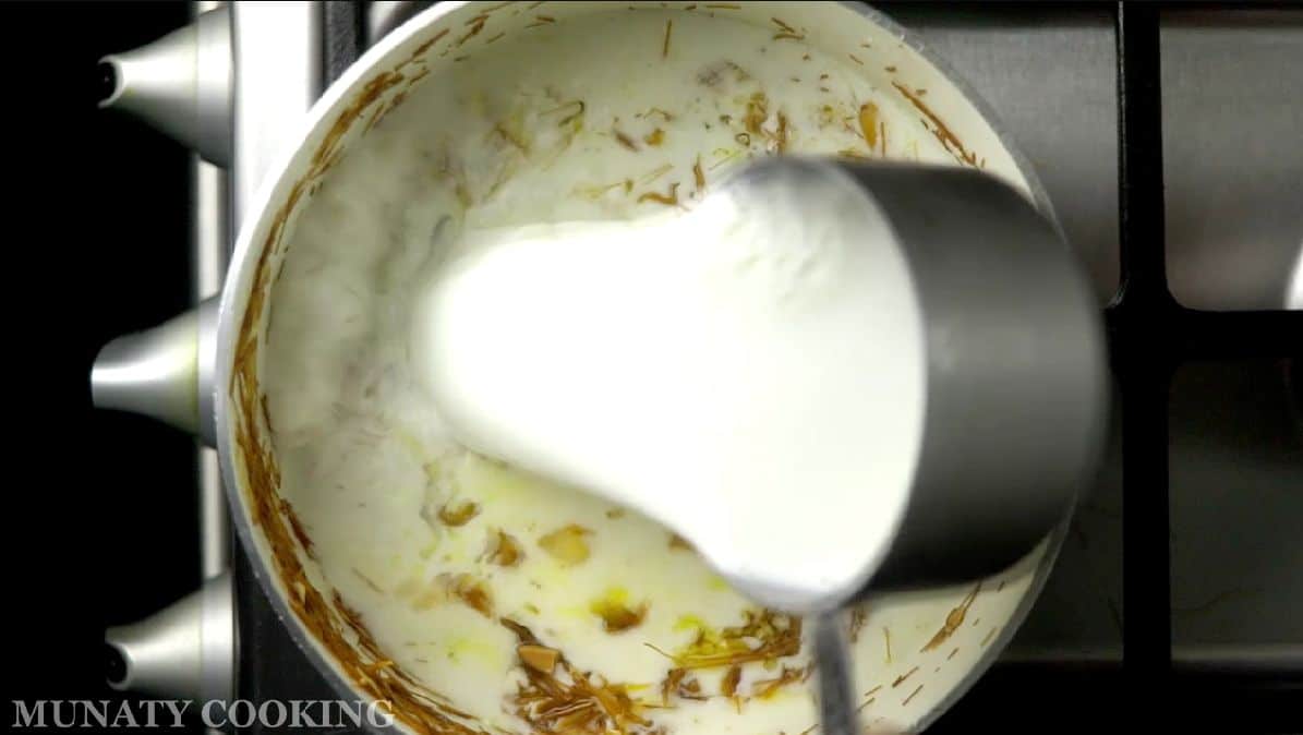 Pouring milk over the mixture.