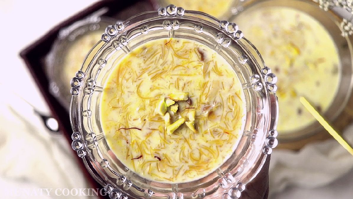 Serving sheer khurma with nuts while warm.