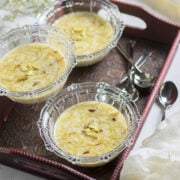 Sheer khurma served in glass bowls and garnished with nuts.