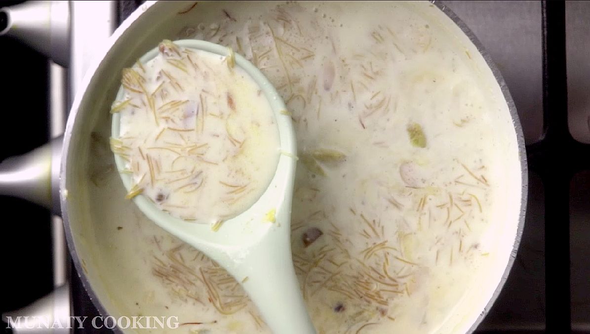 Simmiring the sheer khurma until thick.