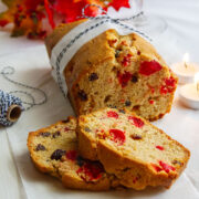 Simple fruitcake on white parchment paper.