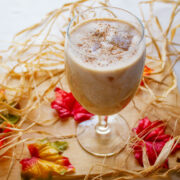 Cantaloupe Smoothie Served in a glass with ice cube.