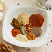 Taco seasoning spices in a white plate.