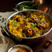 Mutton Taharai served in a stainless steal bowl.