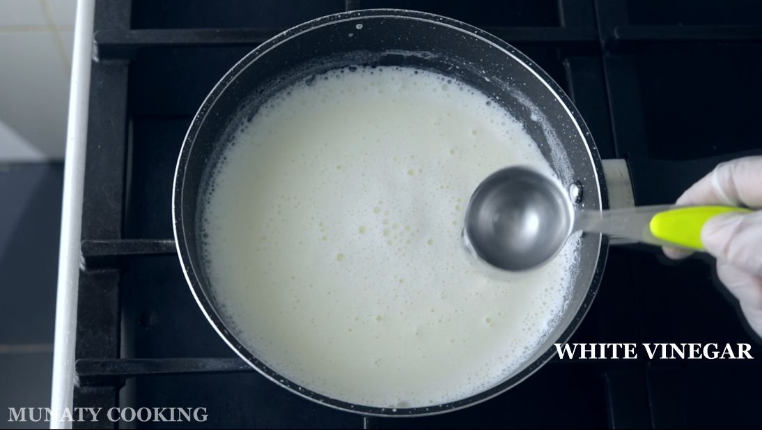 Adding vinegar to milk.