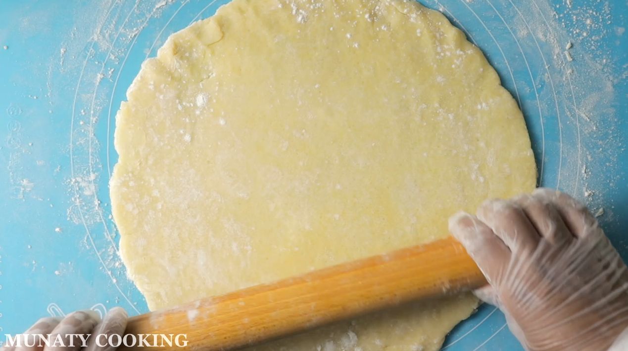 Rolling out the pie dough.