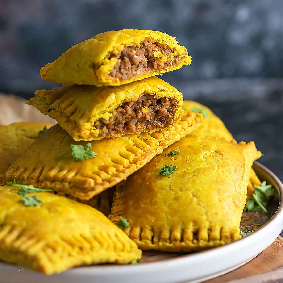 Showing close up of open jamaican beef patties.