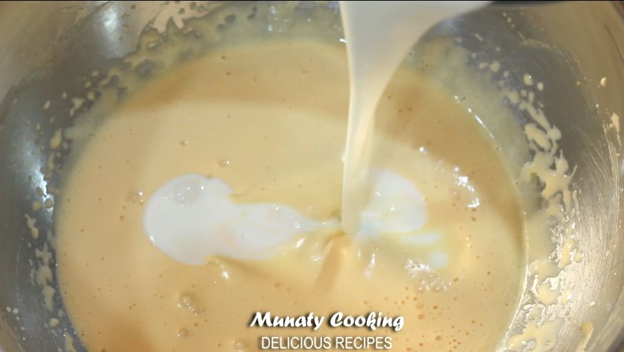 Adding cream to the egg mixture in a bowl.