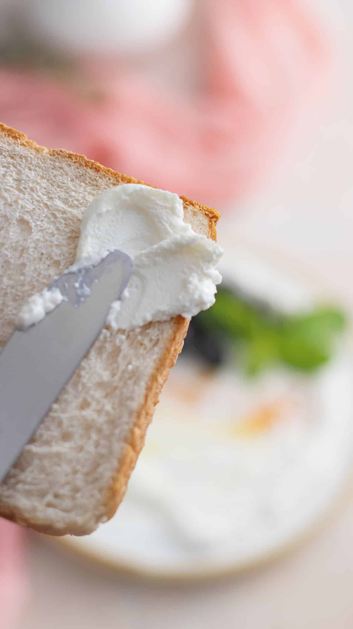 Fresh homemade labneh spread over toast showing how creamy the texture is.